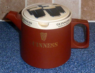 Hornsea Terra Sigillata tea pot with fake Guinness adverts