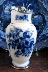 Carlton Ware flow blue Hibiscus jug with silver mount