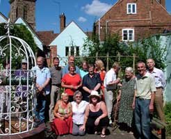 Members in the garden of Tudor House Museum