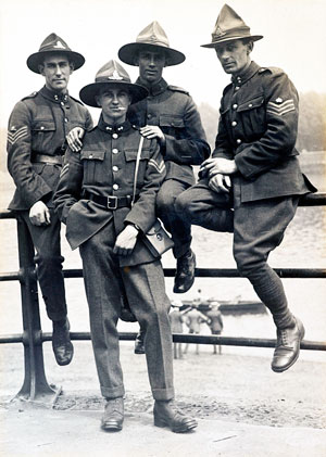 Four New Zealand soldiers wearing campaign hats.