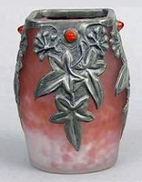 A glass vase with repoussé overlay